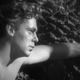 Tarzan standing by a tree